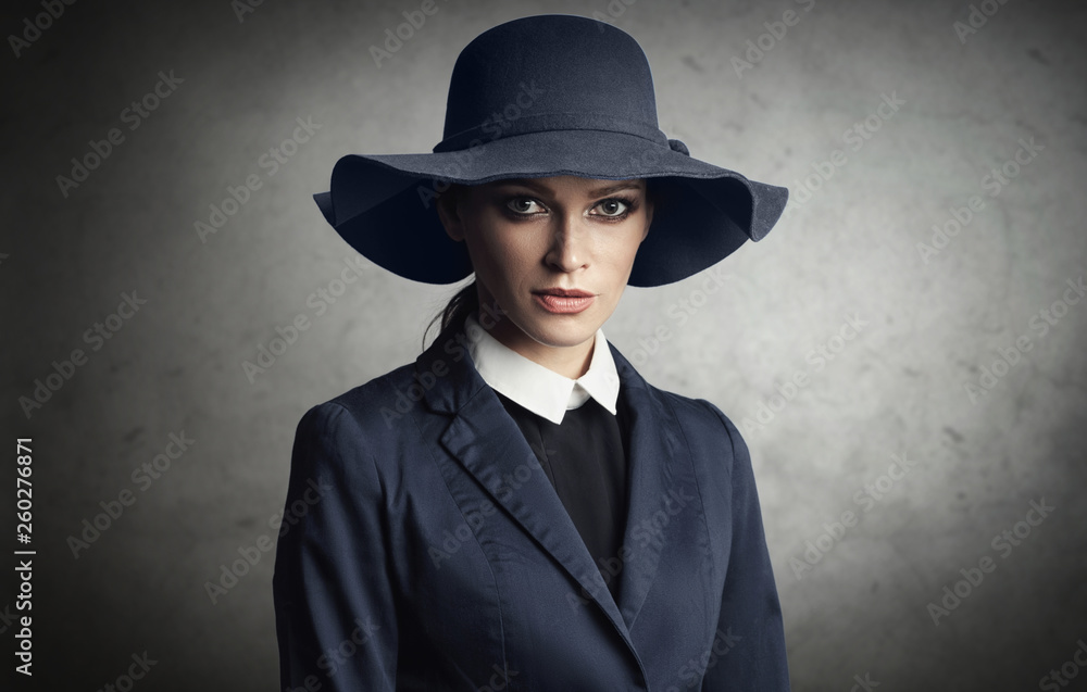fashionable woman is wearing blue hat and jacket fashionable woman is wearing blue hat and jacket