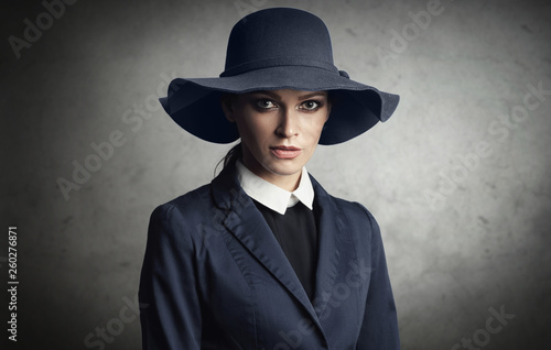 fashionable woman is wearing blue hat and jacket