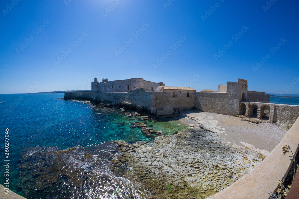  fisheye landscape on coast of Ortigia with Castello Maniace at city of Syracuse, Sicily, Italy. 