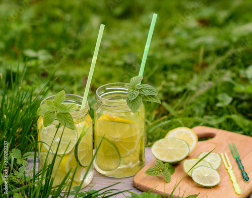 homemade lemon and lime drink. The process of cooking lemonade in the open air