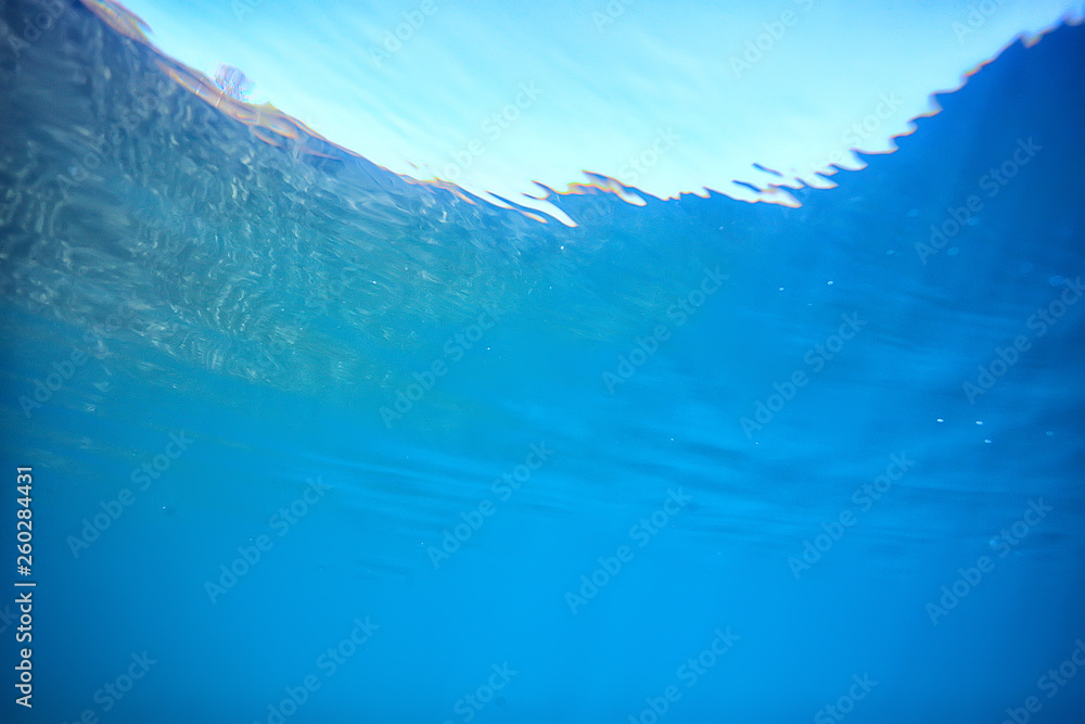 Fototapeta premium ocean water blue background underwater rays sun / abstract blue background nature water