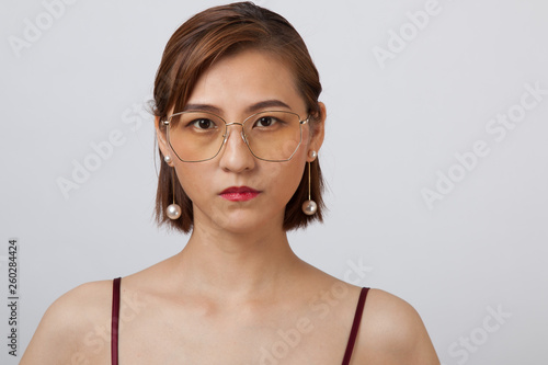 Chinese Girl wearing varies types of fashion sunglasses,looking sharp