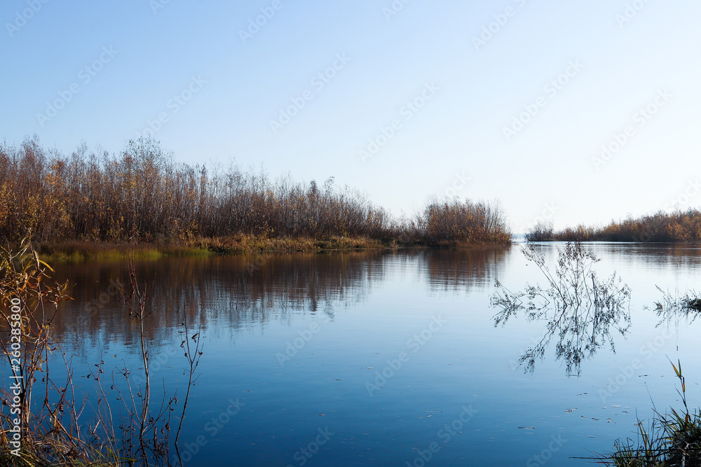 Autumn day in Arkhangelsk. Island Krasnoflotsky. the reflection in the water