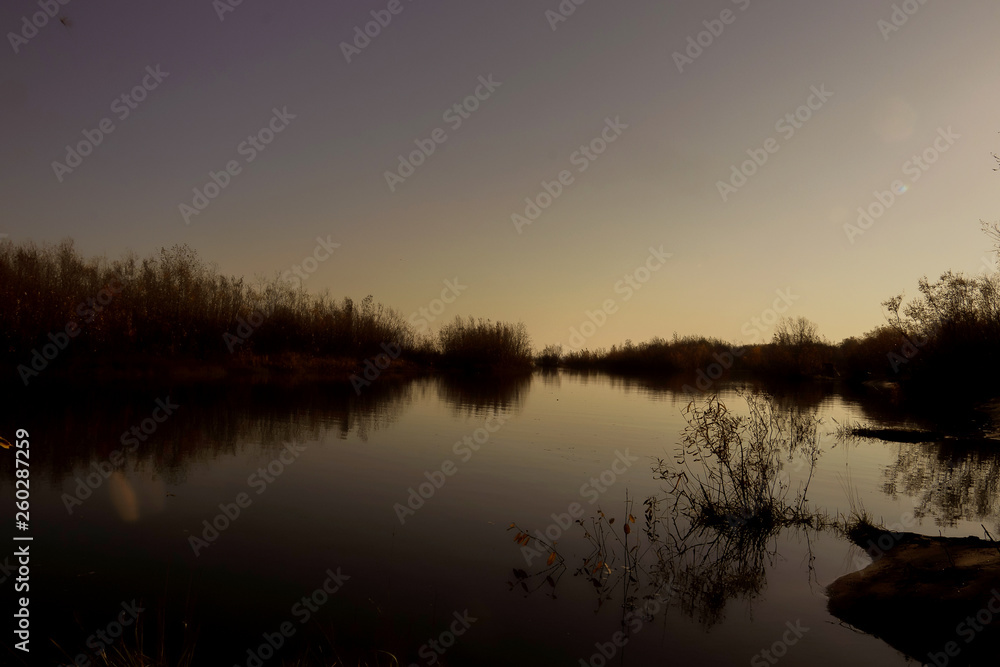 Autumn day in Arkhangelsk. Island Krasnoflotsky. the reflection in the water