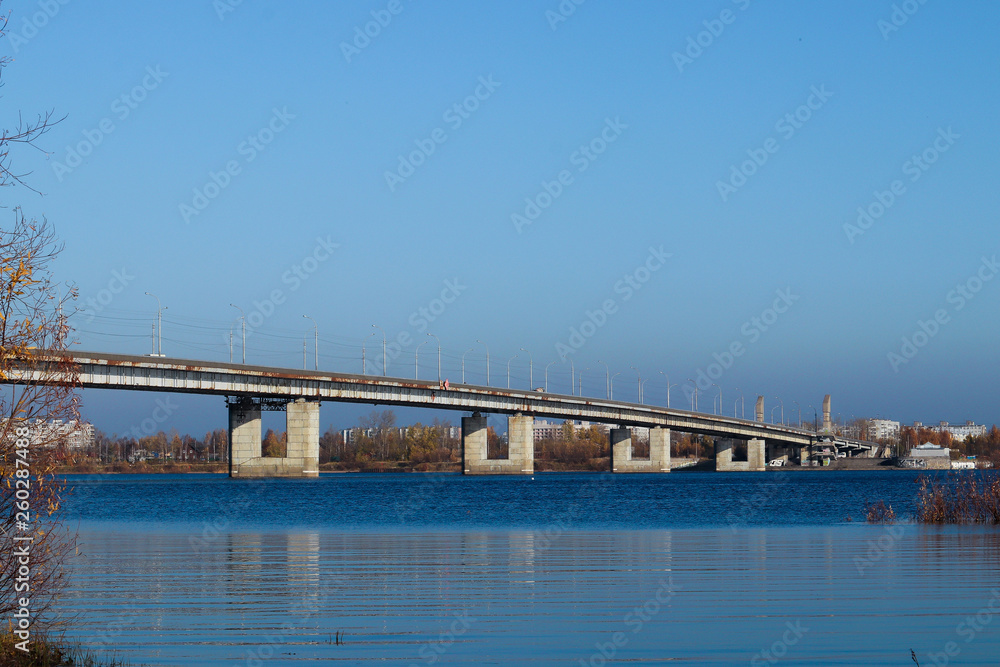 Autumn day in Arkhangelsk. View of the river Northern Dvina and automobile bridge in Arkhangelsk. Autumn day in Arkhangelsk. View of the river Northern Dvina and automobile bridge in Arkhangelsk.