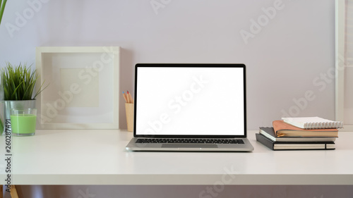 Workspace and blank screen laptop © bongkarn