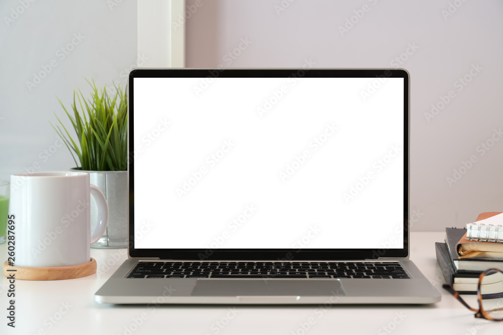 Laptop on white wooden business workspace desk Laptop on white wooden business workspace desk