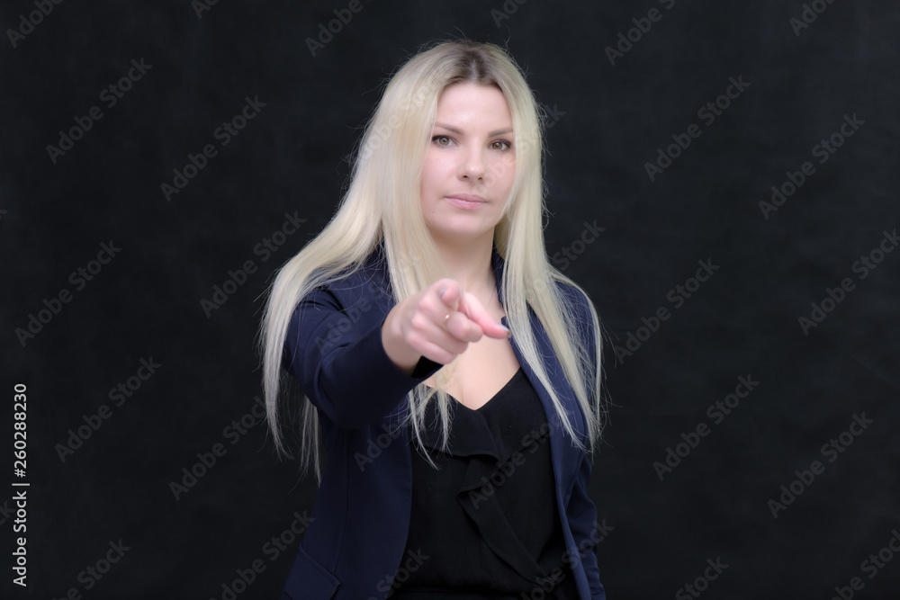 Portrait of happy smiling young cheerful businesswoman standing. Success in business concept studio shot talking to a client. Portrait of happy smiling young cheerful businesswoman standing. Success in business concept studio shot talking to a client.