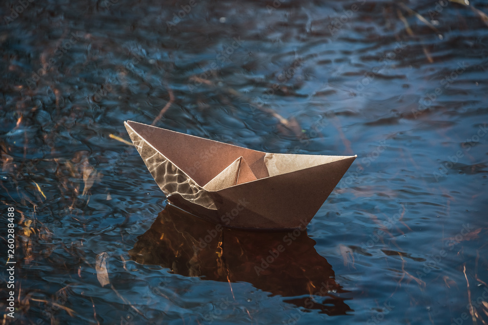 paper boat on water, craft paper, origami boat, launching boats in a lake, stream, river,.