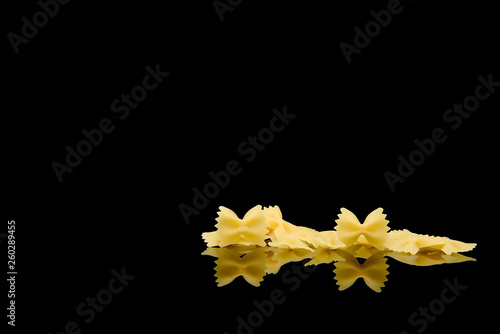 farfale pasta on black background photo