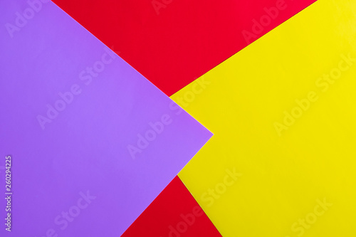 Multicolored horizontal background, colored cardboard. Yellow, red and purple