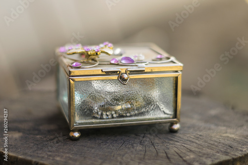 Old jewelry box with purple stones on the top