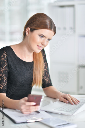 Young attractive woman working