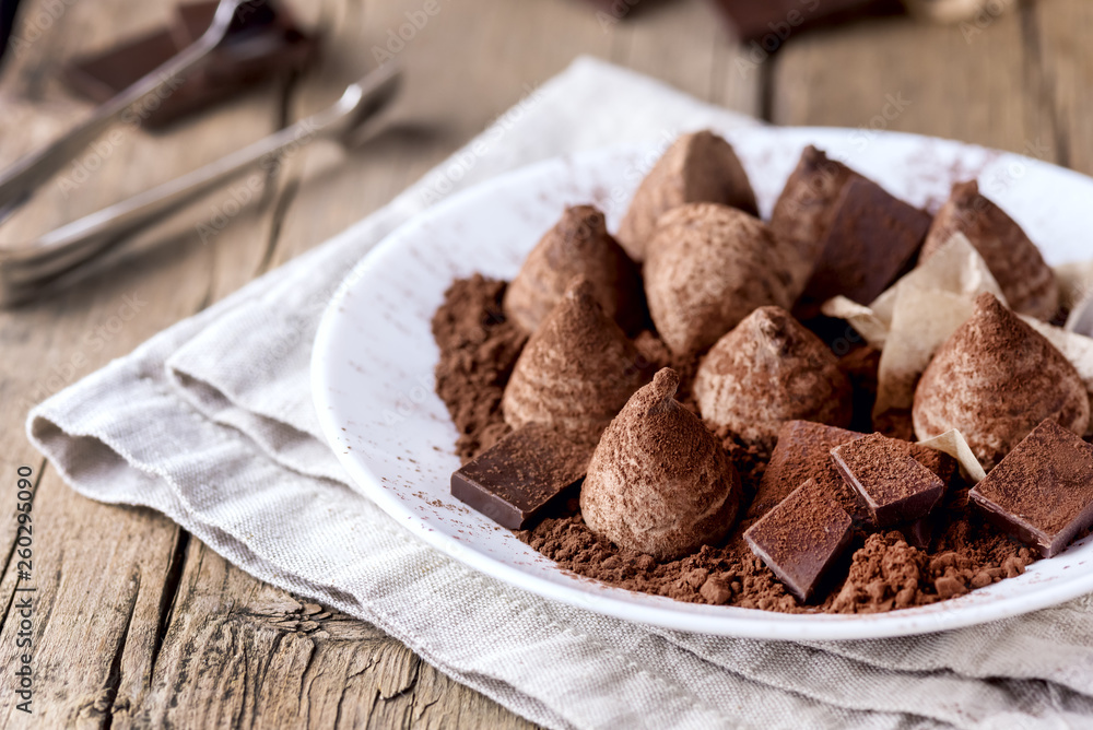 Homemade Chocolate Truffles With Cocoa Powder on a White Plate Old Wooden Background Tasty Candy Horizontal Homemade Chocolate Truffles With Cocoa Powder on a White Plate Old Wooden Background Tasty Candy Horizontal