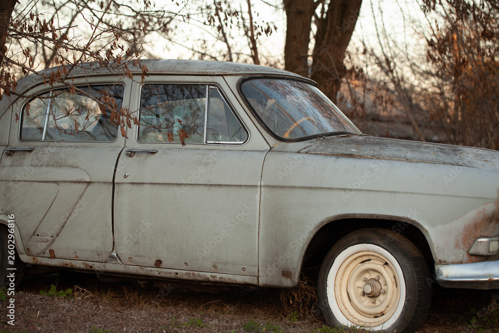 Photo of one old car in the village