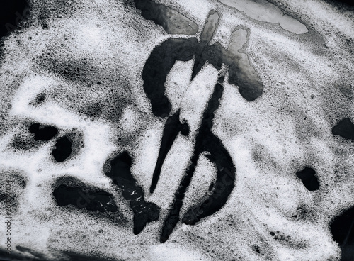 Dollar symbol painted on foam. The concept of offshore, laundering dirty, illegal money. Corruption and bribery.