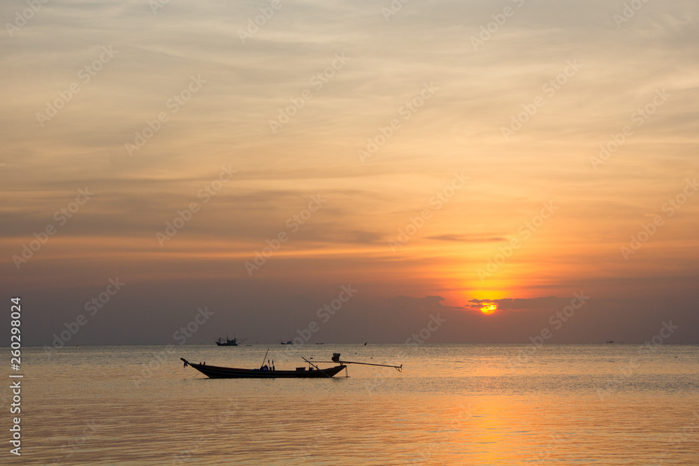 Traditional thai boat at sunset in Thailand