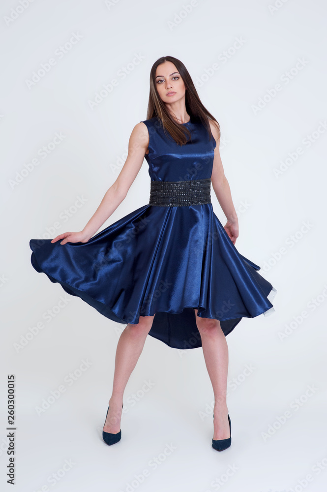 Portrait of the beautiful brunette girl in long blue dress Portrait of the beautiful brunette girl in long blue dress