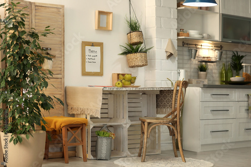 Modern kitchen interior with wooden crates as eco furniture