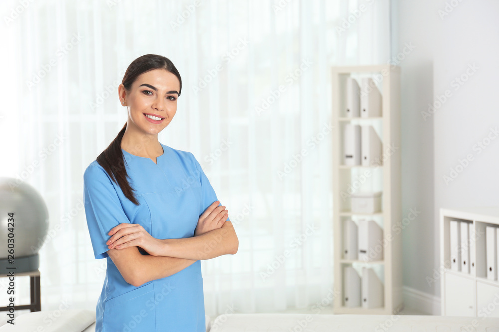 Portrait of young doctor in hospital, space for text. Rehabilitation physiotherapist Portrait of young doctor in hospital, space for text. Rehabilitation physiotherapist