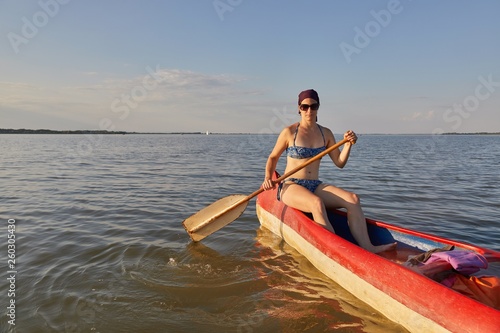Canoeing on a lake © Gudellaphoto