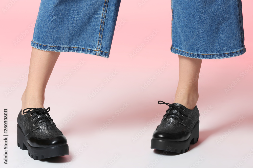 Woman in stylish shoes on color background, closeup Woman in stylish shoes on color background, closeup
