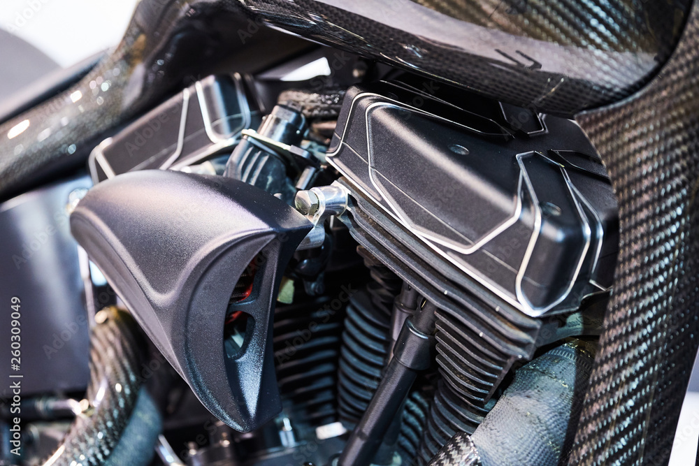 The powerful engine of a modern motorcycle closeup. The layout of the motor The powerful engine of a modern motorcycle closeup. The layout of the motor