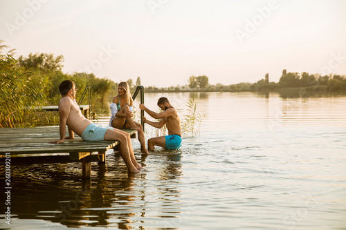 Young people having fun at the lake on a summer day © BGStock72