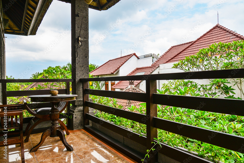 Fototapeta premium Cairs and table on balcony