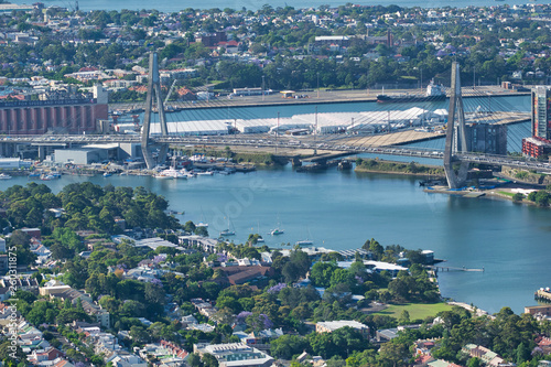 SYDNEY - OCTOBER 2015: Aerial view of Anzac Bridge on a beautiful sunny day. The city attracts 20 million people annually photo