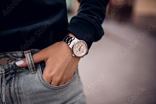 Trendy silver watch on woman hand