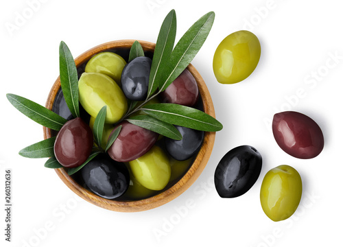 Delicious black, green and red olives with leaves in a wooden bowl, isolated on white background, view from above