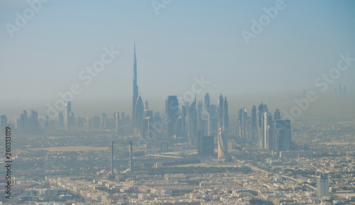Aerial view of Downtown Dubai from the airplane at sunrise