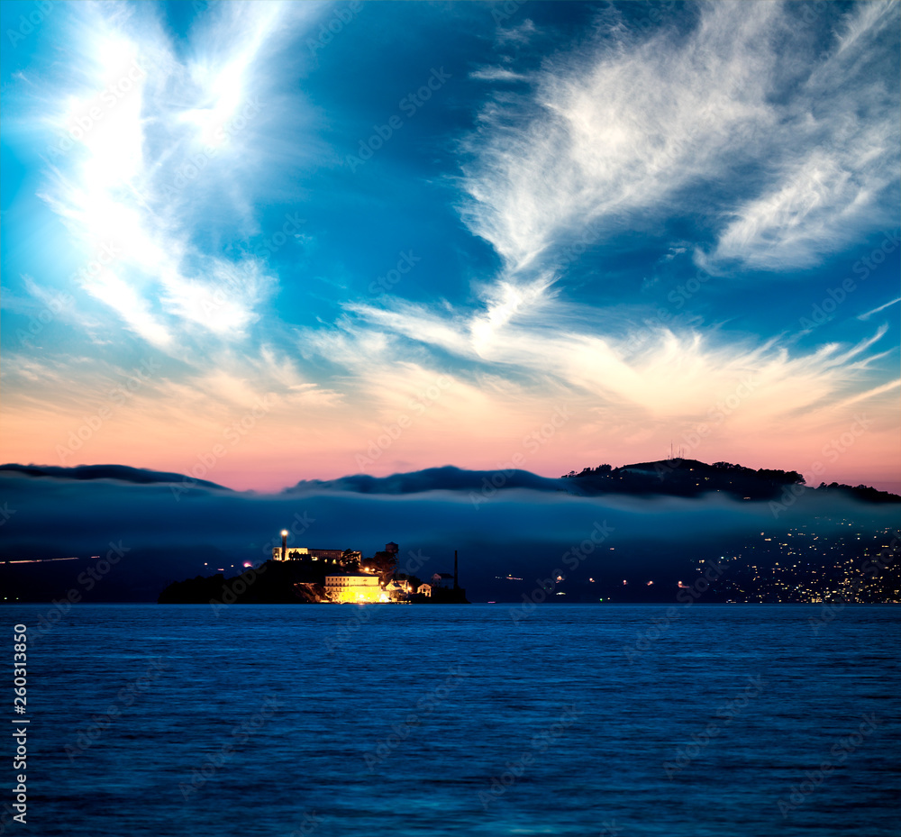 Alcatraz Island at sunset surrounded by the sea, San Francisco