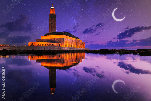 view of Hassan II mosque reflected on water at night - Casablanca - Morocco