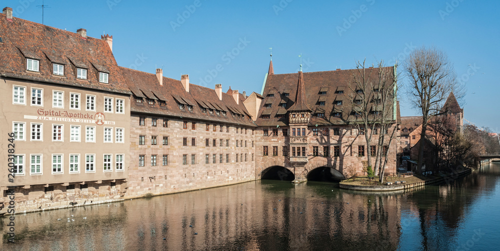 Heilig-Geist-Spital (Hospice of the Holy Spirit) in Old Town Nuremberg. View from the Museum Bridge on the on the River Pegnitz - Nuremberg, Bavaria - Germany