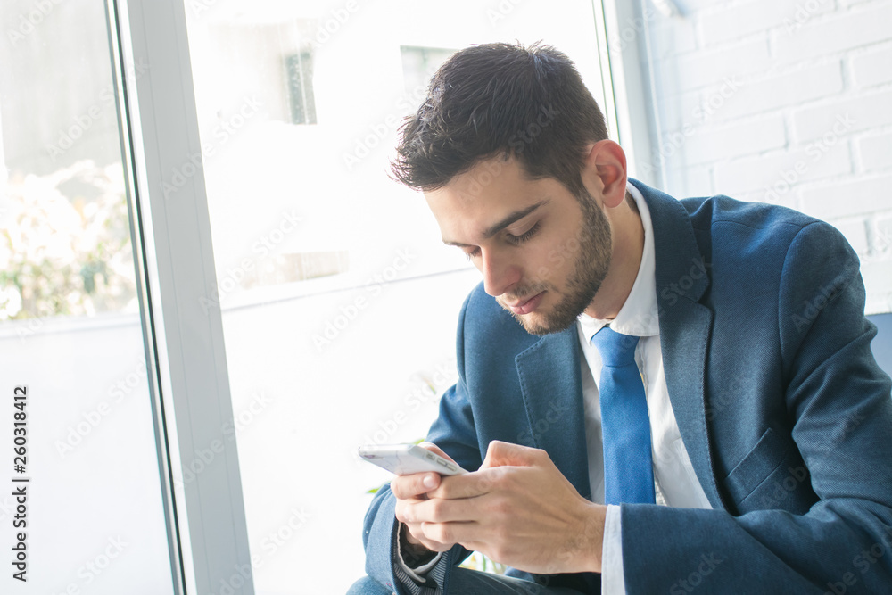 attractive business man with mobile phone attractive business man with mobile phone