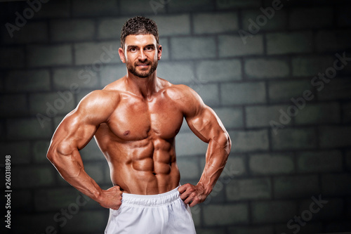 Handsome Bodybuilder Flexing Muscles