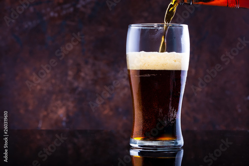 Wallpaper Mural glass of beer with foam on a dark background Torontodigital.ca