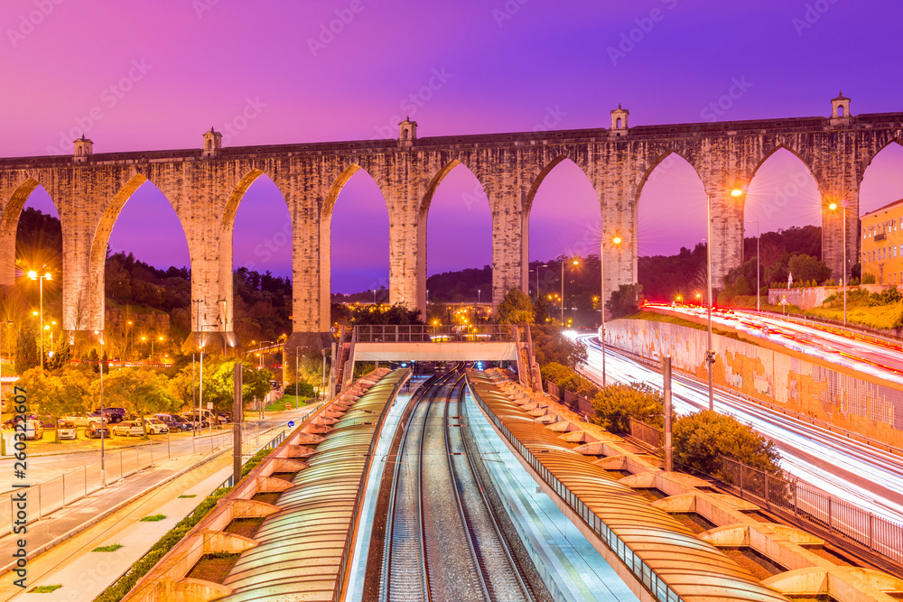 View of the historic aqueduct in the city of Lisbon (Aqueduto das Águas Livres), Portugal. Train station