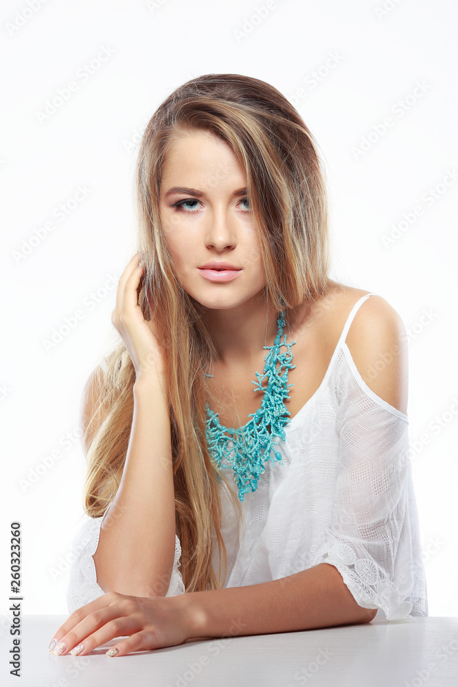 Beautiful sexual blonde in white clothes isolated on a white background Beautiful sexual blonde in white clothes isolated on a white background