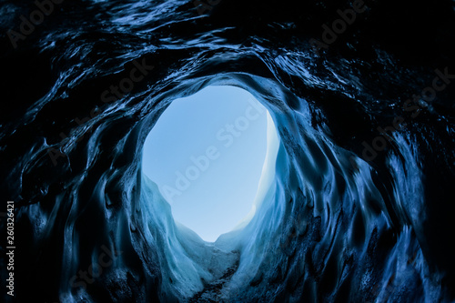 Leinwand Poster Small dark ice cave tunnel on the Matanuska Glacier in Alaska