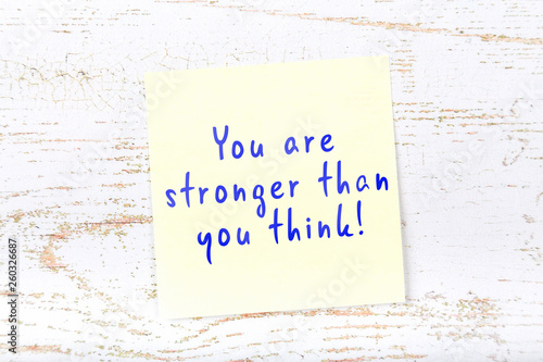 Yellow sticky note with handwritten text you are stronger than you think