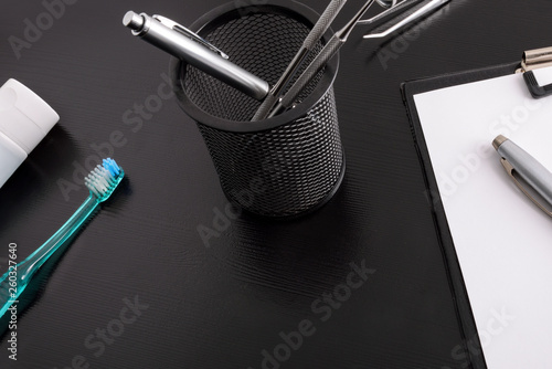 Black dentist table with tools eleveted view photo