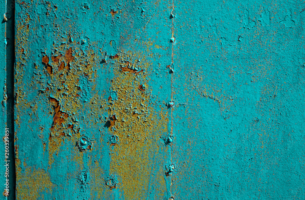 Texture of rusty metal, painted blue which becames orange from rust. Horizontal texture of cracks and peels paint on rusty welded steel sheets