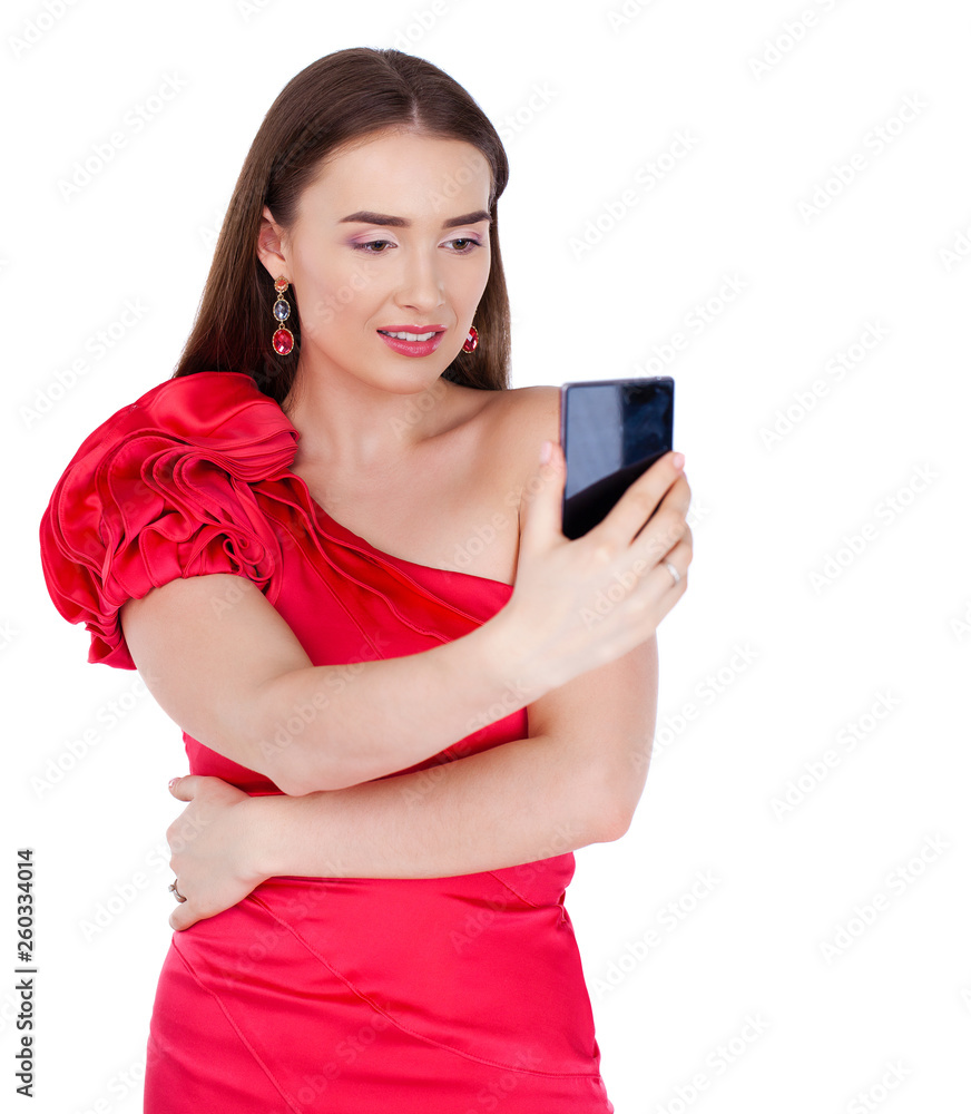 Pretty happy brunette woman making selfie on smartphone, isolated on whiteM