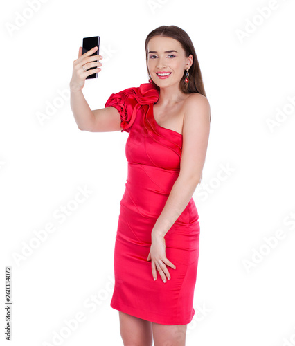 Pretty happy brunette woman making selfie on smartphone, isolated on whiteM photo