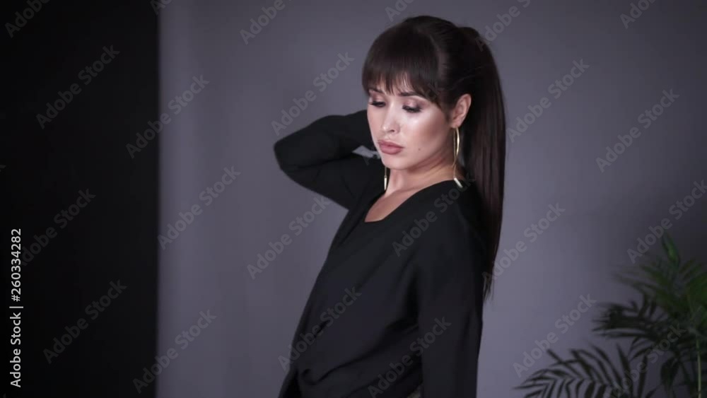 girl posing in the studio.  Italian clothes for girls