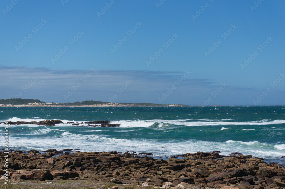 Ocean landscape with mild waves and clear sky