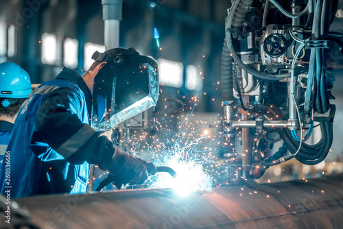 man welds at the factory